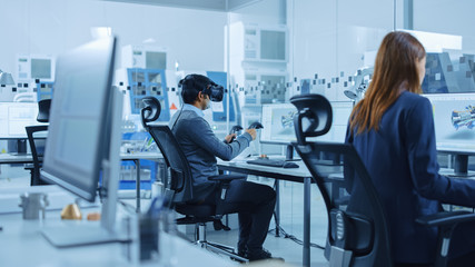 Poster - Modern Factory: Industrial Design Engineer Wearing Virtual Reality Headset and Holding Controllers, Uses VR technology for Industrial Design, Development and Prototyping in CAD Software on Computer.