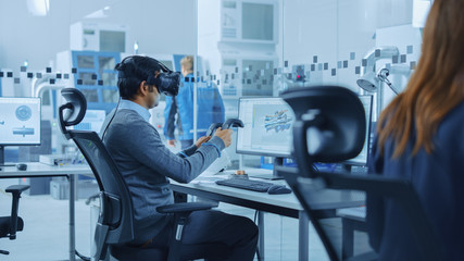Poster - Modern Factory: Industrial Design Engineer Wearing Virtual Reality Headset and Holding Controllers, Uses VR technology for Industrial Design, Development and Prototyping in CAD Software on Computer.