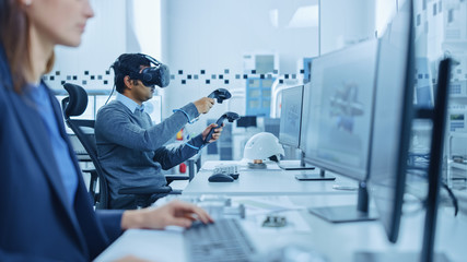 Aufkleber - Modern Industrial Factory: Mechanical Engineer Wearing Virtual Reality Headset, Holding Controllers, Uses VR technology for Industrial Design, Development and Prototyping in CAD Software on Computer.