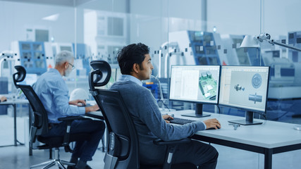Poster - In Clean Workshop: Professional Workers in Coveralls and Masks Use Laptop and Talk. Inside Factory Office: Female Electronics Engineer Works on Computer, Screen Shows Printed Circuit Board 3D Design