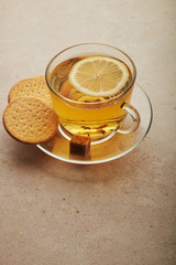 Cup and teapot of green tea with lemon and sugar isolated on white