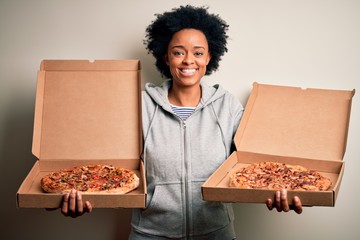 young beautiful african american afro woman smiling happy and confiden. standing with smile on face 