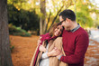 © Jelena - Beautiful couple hugging while enjoying autumn in the park.