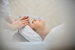 © Max - young woman during cosmetological procedure of face massage