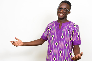 Wall Mural - Portrait of happy young African man in traditional clothing