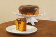 © Elton - Slice of homemade carrot cake with chocolate icing. White background.