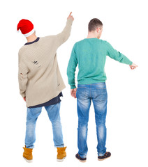 Back view of two man in sweater pointing.