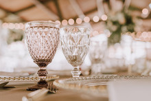 Beautiful Empty Wineglasses On Banquet Table On Blurred Background In Modern Restaurant 