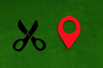 Fototapete - Scissors, geolocation sign on a green background. Location of the Barber's services.