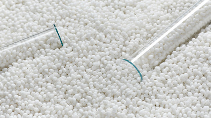 Wall Mural - Closeup of a granule of white plastic polymer