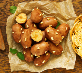 Sticker - Chocolate cake with cream in the form of potatoes.