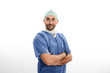 © W PRODUCTION - portrait of an handsome man male surgeon wearing surgical scrub suit studio shot isolated on white background