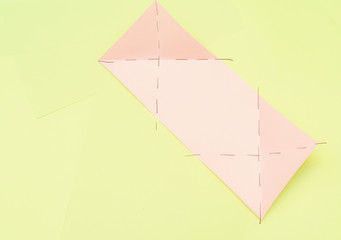 Origami pink heart on a green background, step by step instructions. as great idea for a hand made diy Valentine s Day, Mothers day gift. Step 5