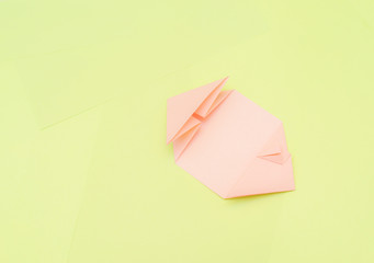 Origami pink heart on a green background, step by step instructions. as great idea for a hand made diy Valentine s Day, Mothers day gift. Step 11