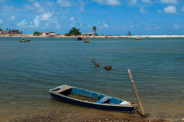 Small boat anchored at the mouth of the ceara-mirim river, Extremoz, near Natal, Rio Grande do Norte, Brazil on February 8, 2014