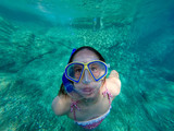 Fototapeta  - Little girl diving