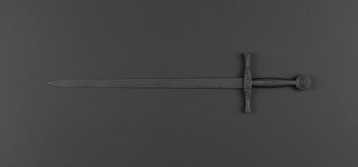 black sword isolated on black background