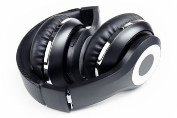 Black stylish professional wireless headphone on white background. High-quality music studio headset.