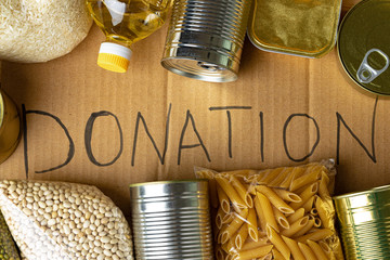 Poster - Food donations on the table. Text Donation. Close up.