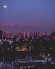 Full Moon Over Santiago Skyline With Purple Sky Night, Chile