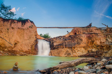 Scenic View Of Waterfall Against Sky