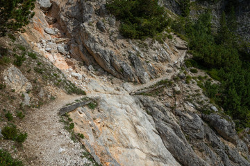 Rocky mountain slope covered with grass in the dolimites