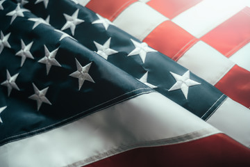 American or USA Flag in sunlight, close up.