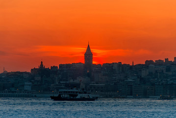 Wall Mural - Beyoglu, Istanbul, Turkey, 17 April 2015: Galata Tower, King of Byzantine Anastasius, 528, Sunset.