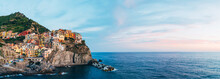 Buildings On Mountain By Sea At Manarola