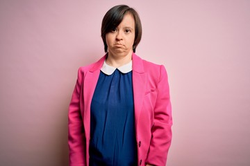 Sticker - Young down syndrome business woman over pink background depressed and worry for distress, crying angry and afraid. Sad expression.