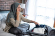 © Odua Images - Young Muslim women are sad because they cannot go home because some area lockdown activity for travelers