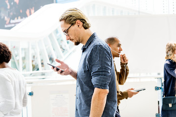 Poster - Blond man texting on his phone