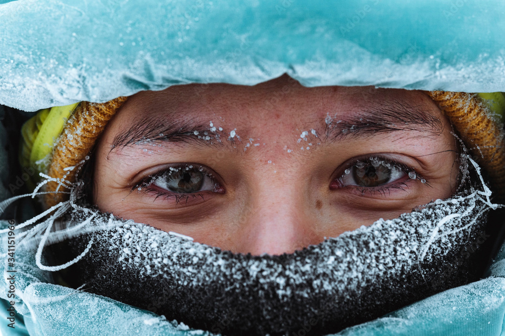 Closeup of a female mountaineer in wintertime at Glen Coe, Scotland