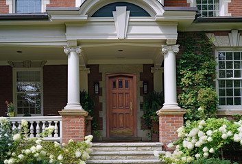 Wall Mural - Large old fashioned porch surrounded by hydrangea bushes