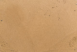 Flat sand on a beach textured backdrop