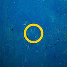 Close-up Of Yellow Circle On Blue Wall