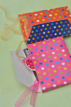 Close-up Of Colorful Paper Bags On Table