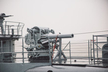 Low Angle View Of Cannon On Battleship Against Sky