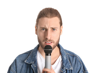 Canvas Print - Young male singer on white background