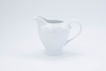 Wall Mural - cup with tea and teapot on white background, over light
