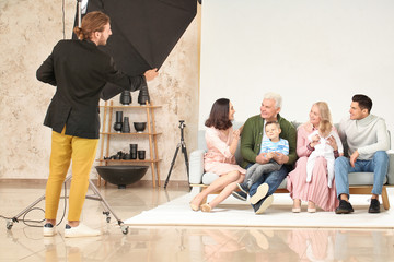 Wall Mural - Photographer working with family in studio