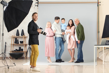 Wall Mural - Photographer working with family in studio