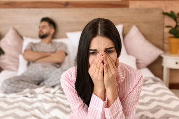 Wall Mural - Sad couple after quarrel in bedroom