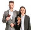 © Pixel-Shot - Beautiful young couple with tasty chocolate on white background