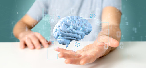 Poster - businessman holding a intelligence artificial brain with data - 3d rendering
