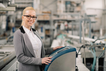 Wall Mural - Factory manager in inspection of manufacturing. Woman in factory.	