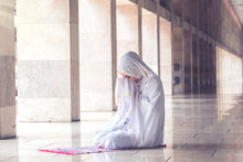 Young Muslim Woman Praying In The Mosque