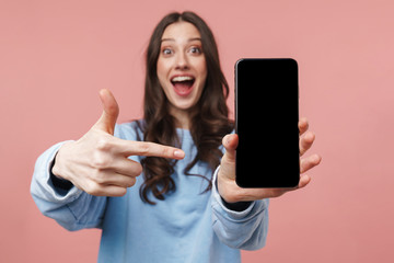 Sticker - Image of attractive young woman smiling and holding cellphone