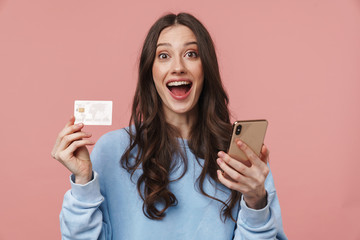 Poster - Image of young woman rejoicing while holding cellphone and credit card