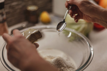 Wall Mural - Process of adding yeast to a dough mixture